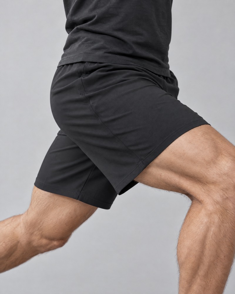 Onyx stretch training shorts in a deep lunge